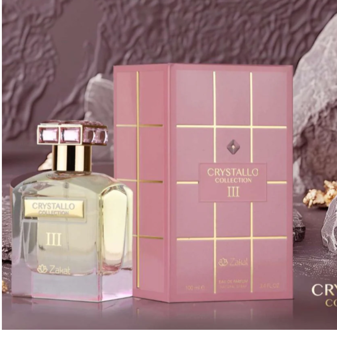 Perfume bottle and packaging with 'Crystallo Collection III' branding on a textured background.
