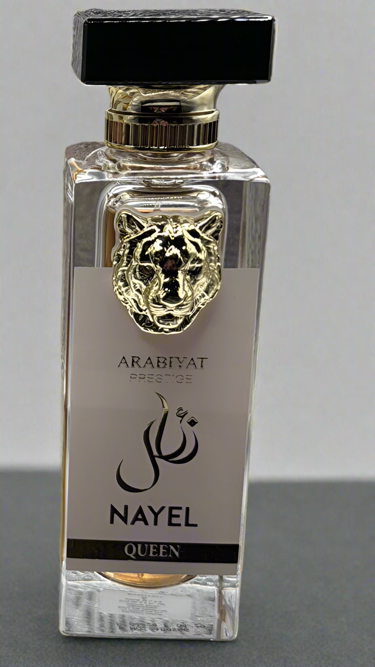 Perfume bottle and packaging with 'Nayel' branding on a reflective surface
