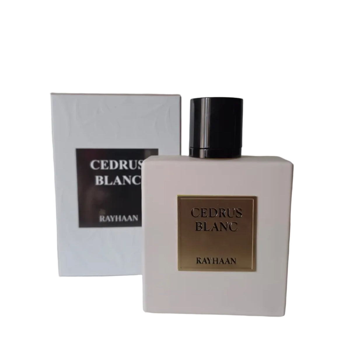A bottle of Rayhaan Cedrus Blanc perfume with a white rectangular bottle and black cap, standing in front of its matching white box on a light surface.