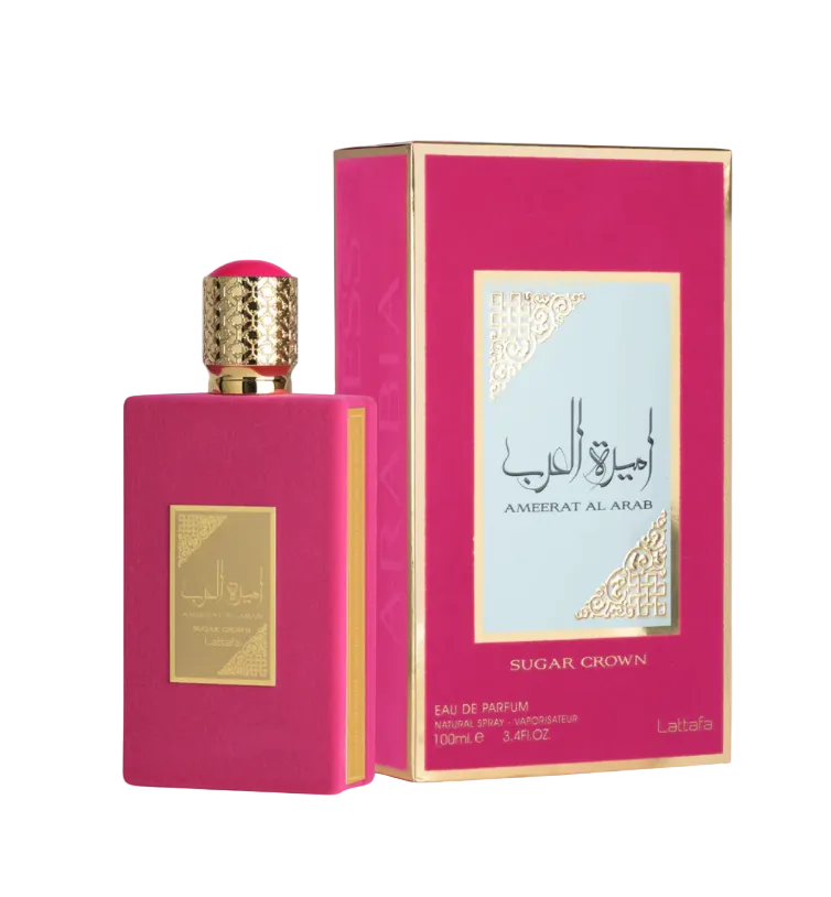 Pink perfume bottle and packaging with gold accents on a white background