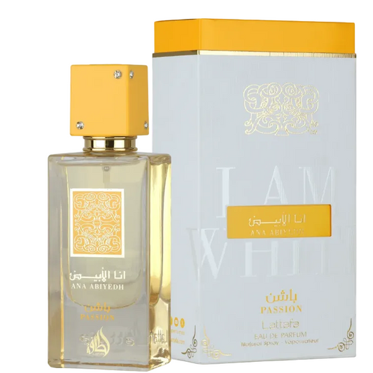 A rectangular glass perfume bottle with a yellow cap stands beside its matching box. The bottle and packaging are labeled in Arabic and English as Ana Abiyeh, with 'Passion' and 'Lattafa' visible on the box.