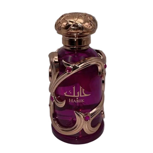 Purple perfume bottle with gold accents on a white background