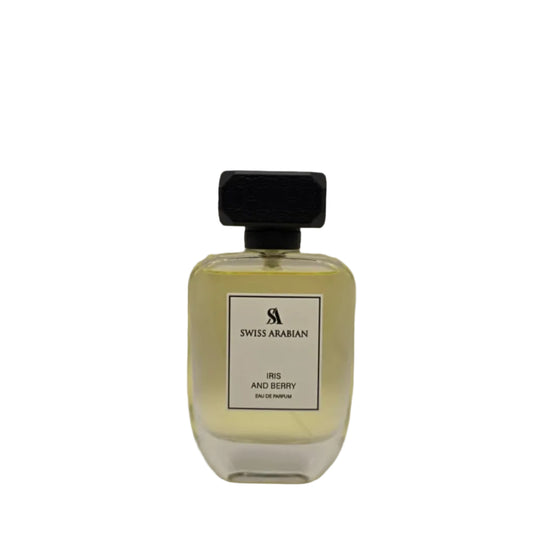 Perfume bottle with black cap and white label on a light gray background
