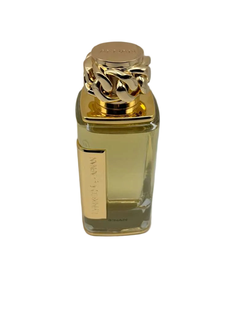 Gold perfume bottle with a gold cap on a white background