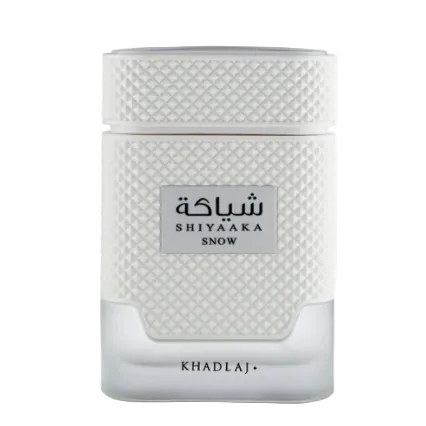 Shiya'aka Snow perfume bottle by Khadlaj, featuring a textured white upper body, a clear frosted lower base, and a silver label with black text.